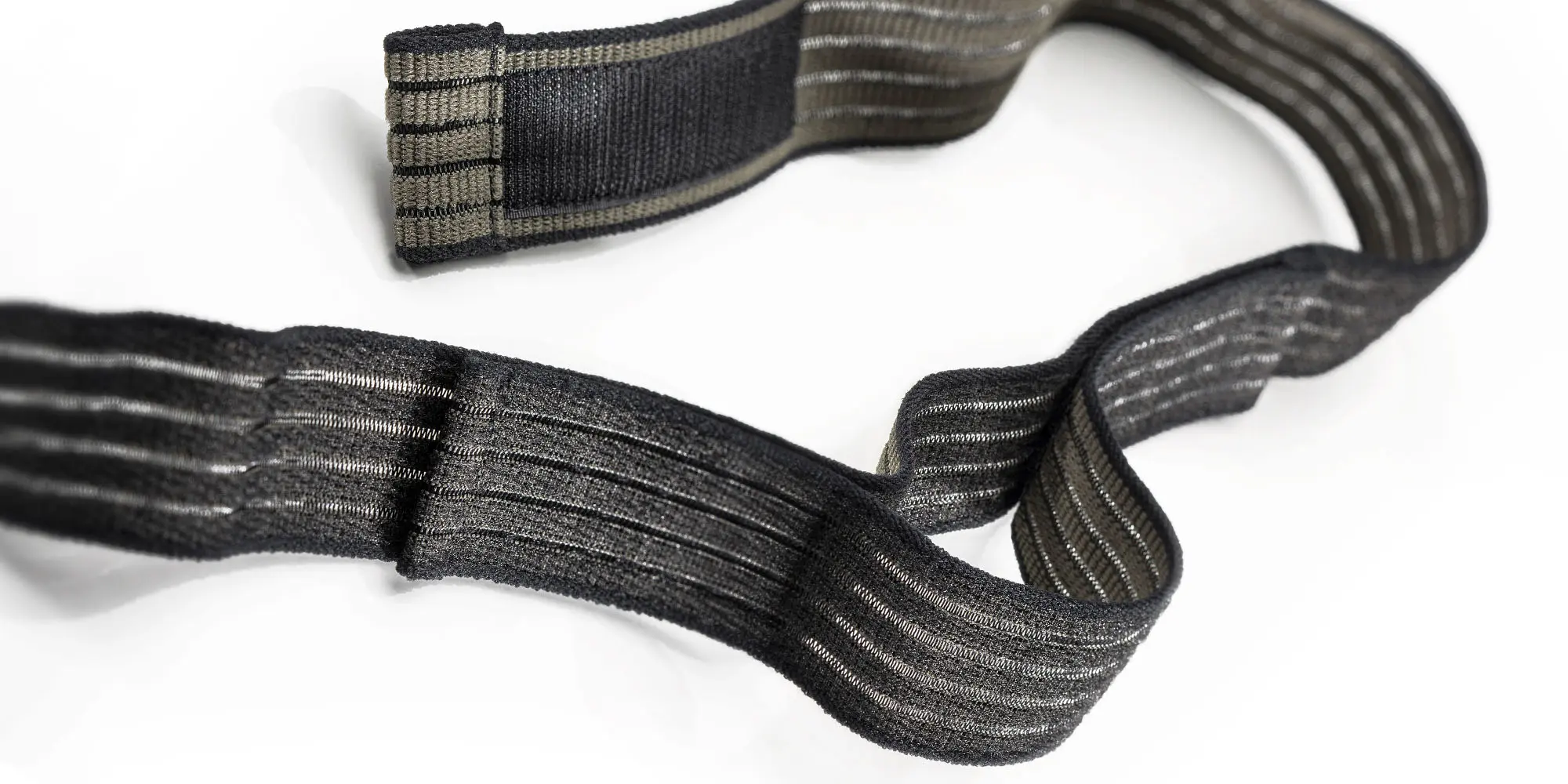 Klettfaehiges Elastikband in oliv-schwarz – JUMBO-Textil